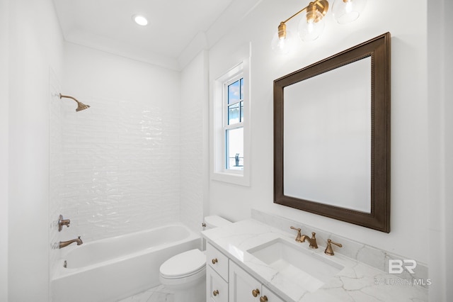 full bathroom featuring vanity, tiled shower / bath, ornamental molding, and toilet