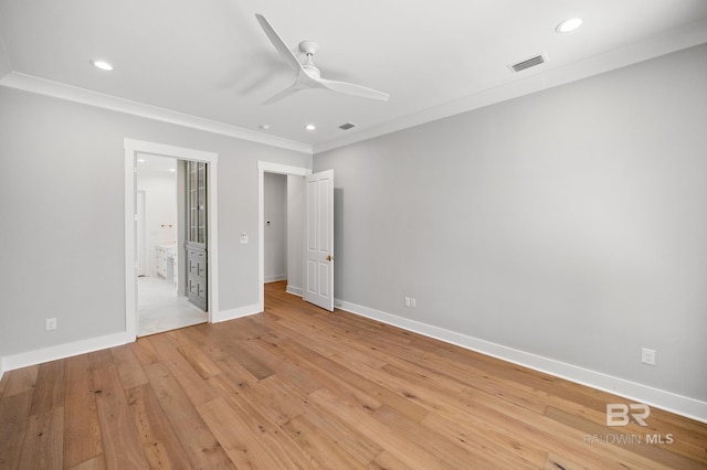 unfurnished bedroom featuring light wood-type flooring, ceiling fan, crown molding, and connected bathroom