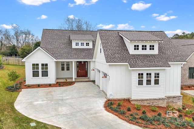 modern inspired farmhouse with a garage