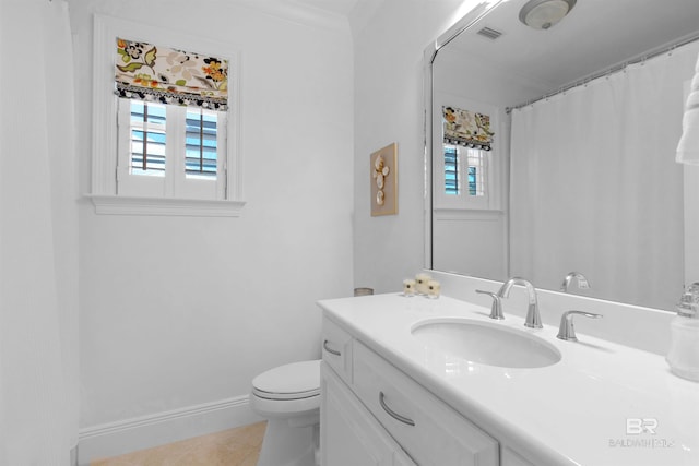 bathroom featuring toilet, vanity, tile patterned flooring, baseboards, and visible vents