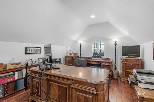 home office with dark wood-style floors and lofted ceiling