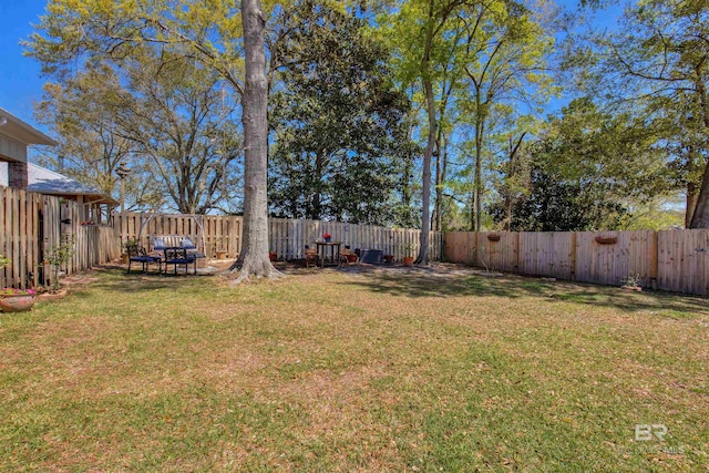 view of yard with a fenced backyard