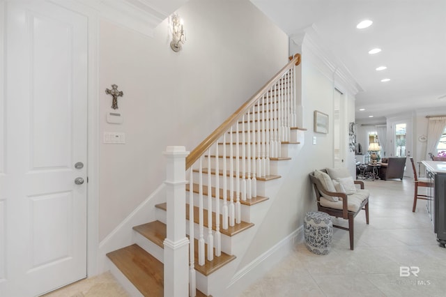 stairway with tile patterned flooring, baseboards, and recessed lighting
