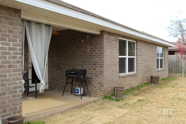 view of home's exterior featuring a yard and a patio