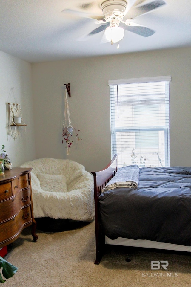 bedroom featuring ceiling fan and carpet floors