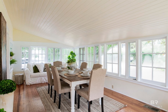 sunroom / solarium with wood ceiling and vaulted ceiling