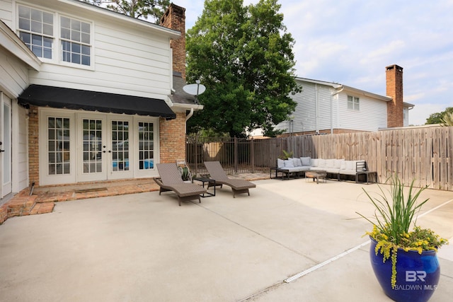 view of patio featuring outdoor lounge area and french doors