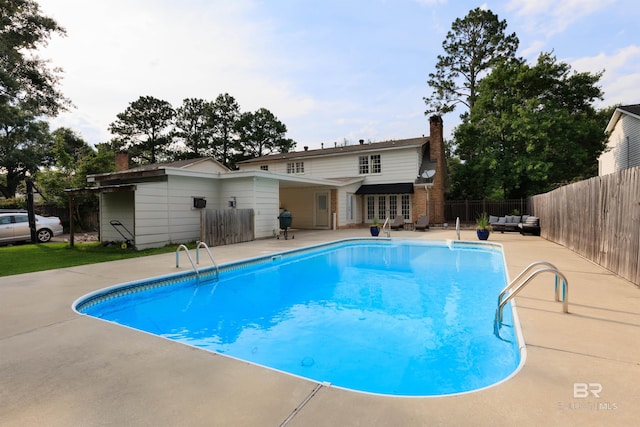 view of pool featuring a patio