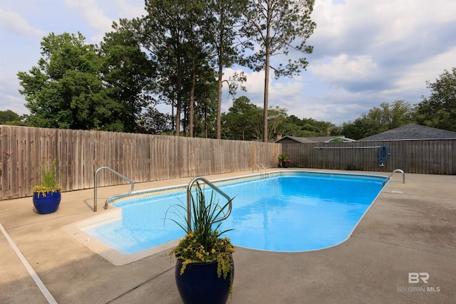 view of pool featuring a patio area