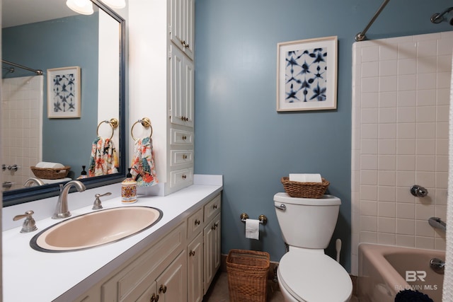 full bathroom with vanity, tiled shower / bath combo, and toilet