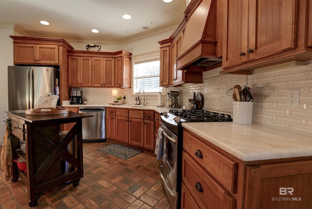 kitchen with custom exhaust hood, brown cabinets, stainless steel appliances, and brick floor