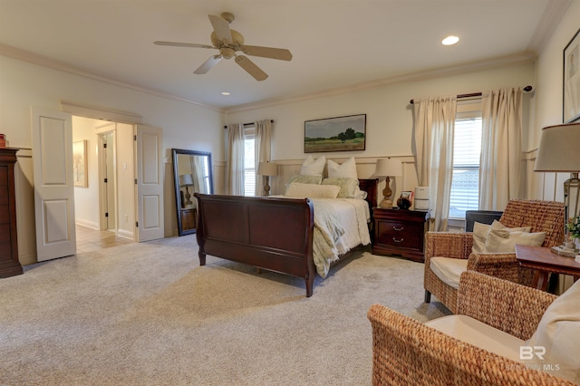 bedroom with ceiling fan, crown molding, multiple windows, and light carpet