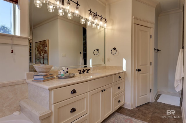 bathroom with vanity, baseboards, ornamental molding, tile patterned floors, and a bathtub