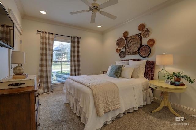 carpeted bedroom featuring ceiling fan, recessed lighting, baseboards, and ornamental molding