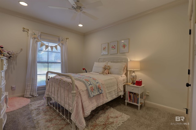 bedroom featuring carpet flooring, baseboards, a ceiling fan, and crown molding