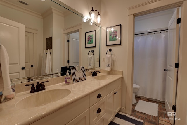 bathroom with visible vents, toilet, brick floor, and a sink