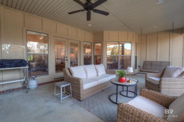 exterior space with wood ceiling, plenty of natural light, and a ceiling fan