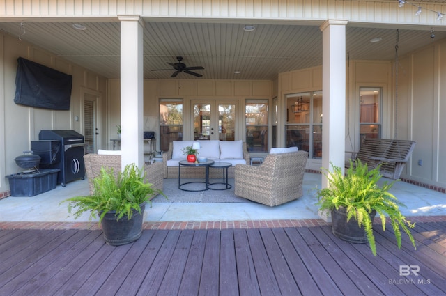 deck with ceiling fan, a patio area, and an outdoor hangout area