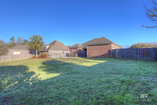 view of yard with a fenced backyard