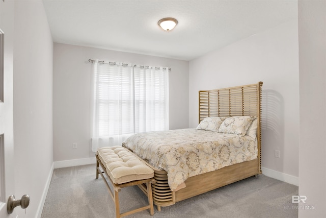 carpeted bedroom with baseboards