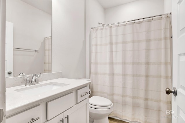 full bathroom with vanity and toilet