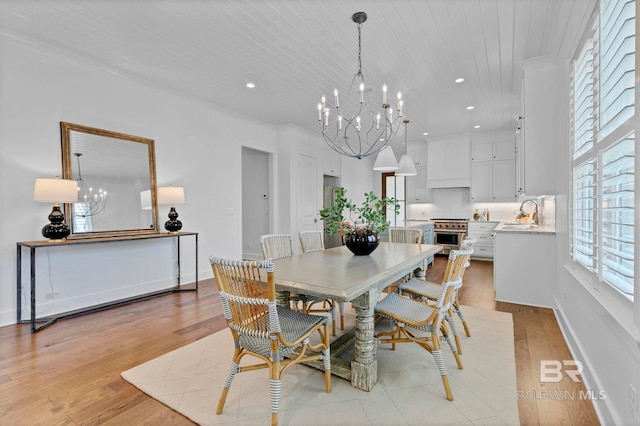 dining space featuring light wood-style floors, recessed lighting, wooden ceiling, and an inviting chandelier