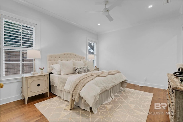 bedroom with light wood-type flooring, visible vents, baseboards, and recessed lighting