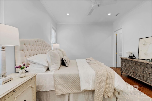 bedroom with ornamental molding, dark wood-type flooring, visible vents, and recessed lighting