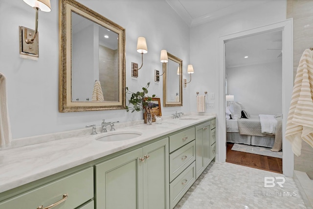 bathroom featuring a sink, double vanity, connected bathroom, and crown molding