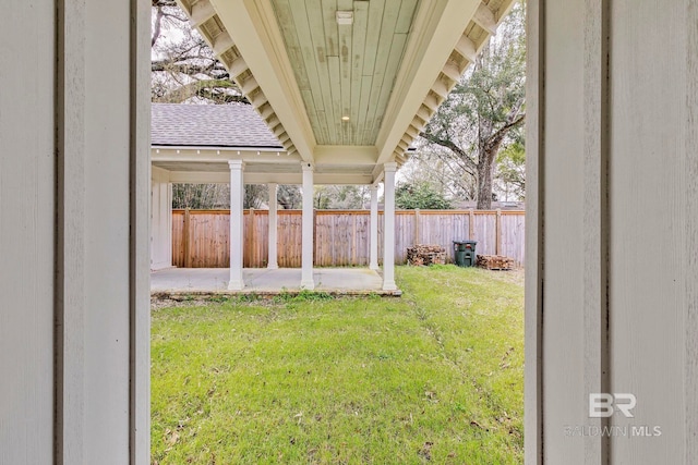 view of yard featuring a patio and fence