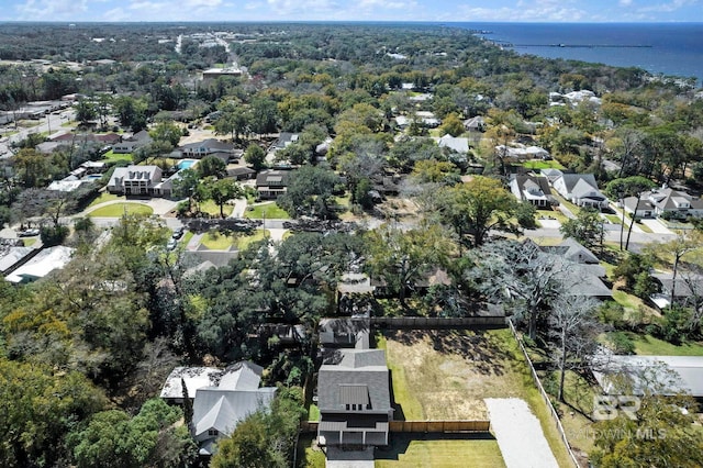 drone / aerial view with a water view and a residential view