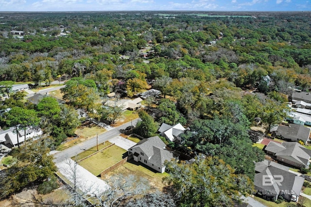 drone / aerial view with a forest view and a residential view