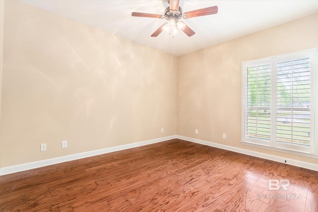 empty room featuring ceiling fan and hardwood / wood-style flooring