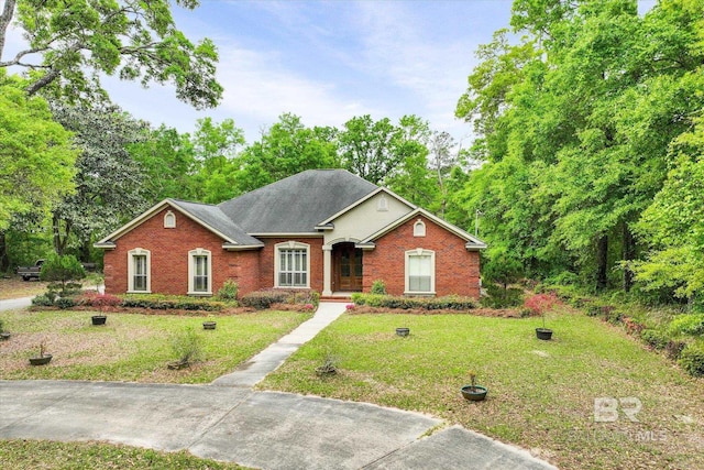 ranch-style home featuring a front yard