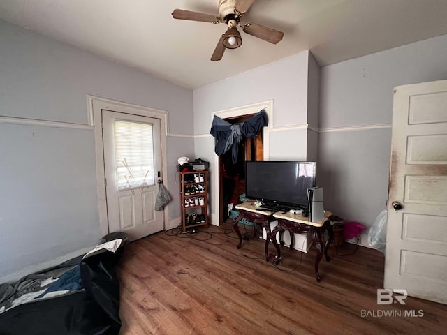 interior space featuring ceiling fan and wood-type flooring