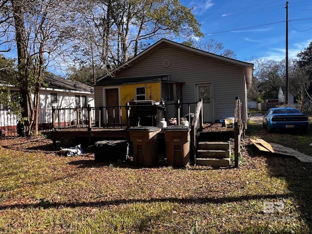 back of house featuring a deck