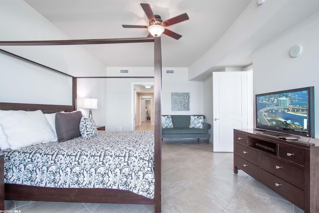 tiled bedroom featuring ceiling fan