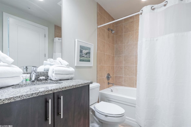 full bathroom featuring shower / bath combination with curtain, toilet, and vanity