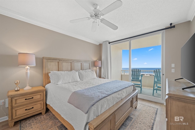 375 Beach Club Trl Unit B404, Gulf Shores, AL 36542 - bedroom with floor to ceiling windows, access to outside, light wood-type flooring, crown molding, and a textured ceiling