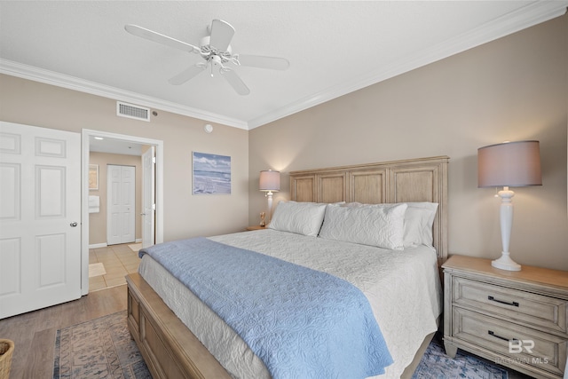 375 Beach Club Trl Unit B404, Gulf Shores, AL 36542 - bedroom with ornamental molding, wood finished floors, and ceiling fan