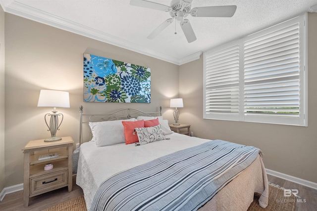 375 Beach Club Trl Unit B404, Gulf Shores, AL 36542 - bedroom featuring wood finished floors, baseboards, ornamental molding, and a ceiling fan