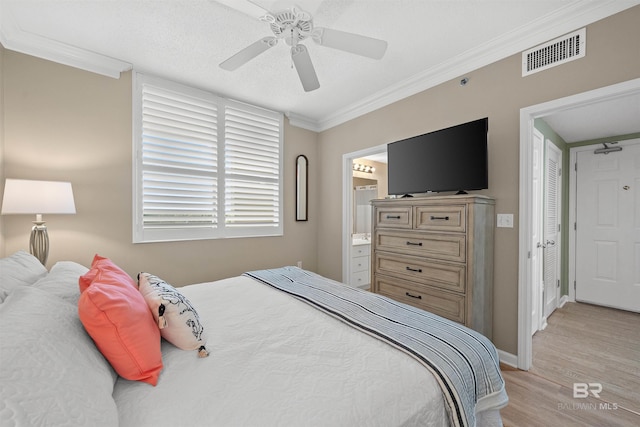 375 Beach Club Trl Unit B404, Gulf Shores, AL 36542 - bedroom featuring ornamental molding, light wood-style floors, ceiling fan, baseboards, and connected bathroom