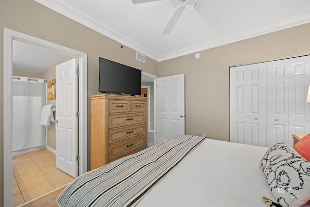 375 Beach Club Trl Unit B404, Gulf Shores, AL 36542 - tiled bedroom featuring ornamental molding, a closet, and a ceiling fan
