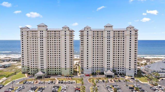 375 Beach Club Trl Unit B404, Gulf Shores, AL 36542 - view of building exterior featuring a water view and uncovered parking