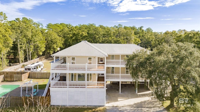 rear view of house with a balcony