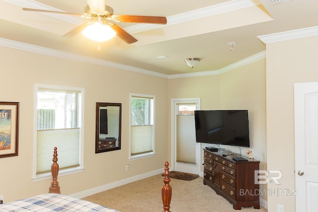 carpeted bedroom featuring ceiling fan, ornamental molding, and multiple windows