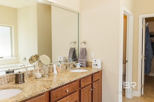 bathroom featuring tile patterned floors and vanity