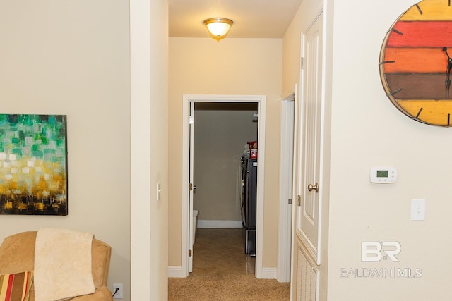 hall featuring light colored carpet