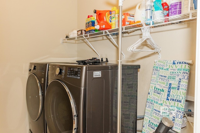 laundry area with separate washer and dryer