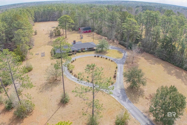 aerial view with a rural view and a view of trees